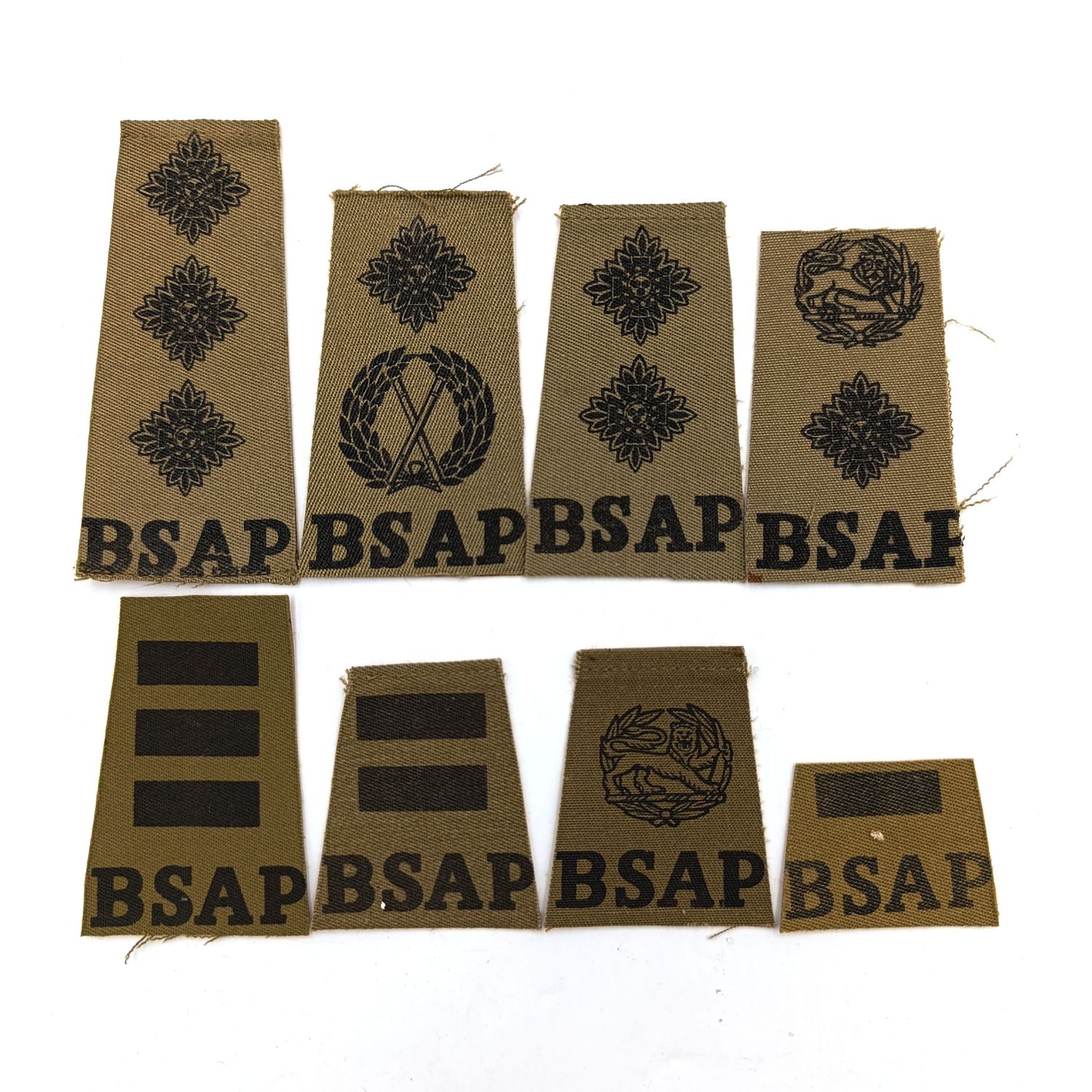 Set of 8 Rhodesia BSAP rank epaulette cutouts on board backing