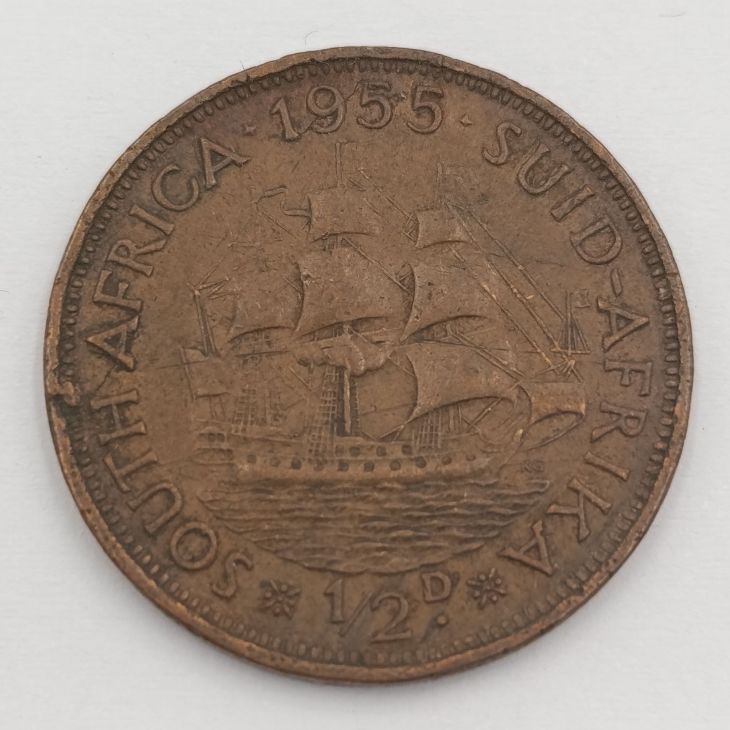 1955 South Africa half penny with cracked die marks A of Africa and 1955
