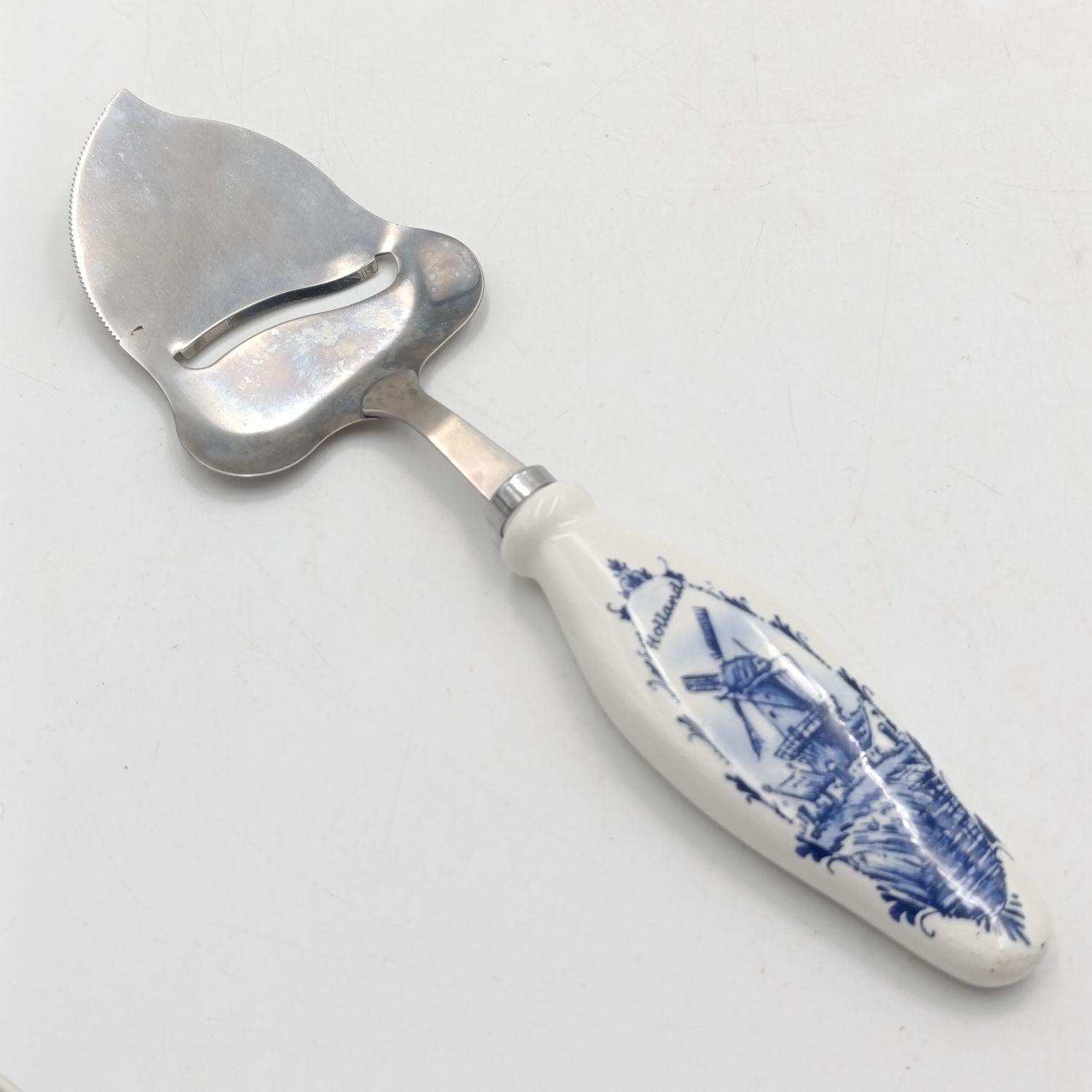 Vintage Cheese cutter with porcelain Holland handle