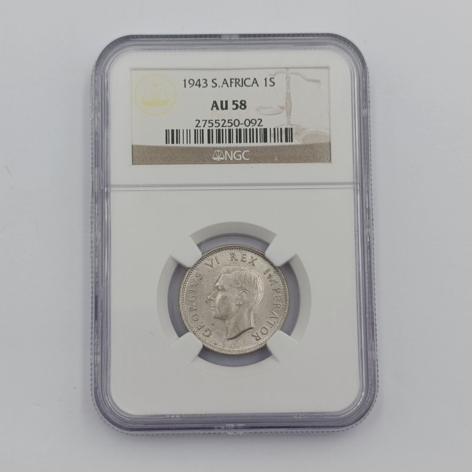 1943 SA Union silver 1 Shilling graded AU 58 by NGC