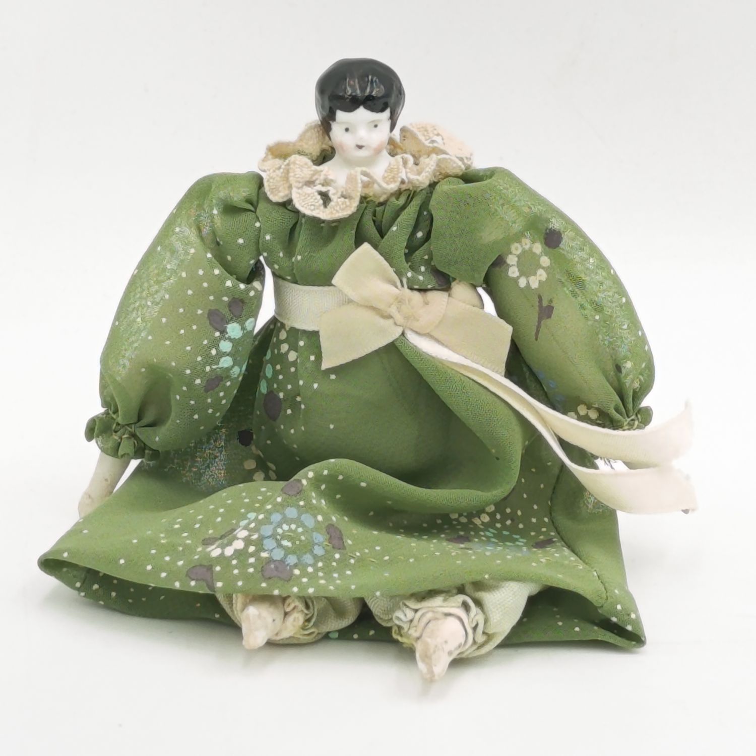 Dark hair rosy cheeks antique doll - 15cm long