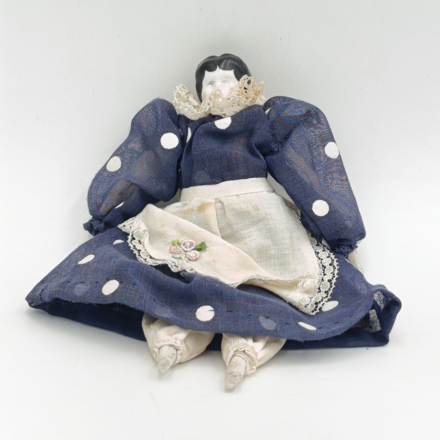 Dark hair rosy cheeks antique doll - 17cm long