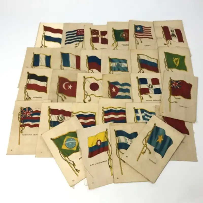 Lot of 27 Flags of all Nations silk cigarette cards on paper backing