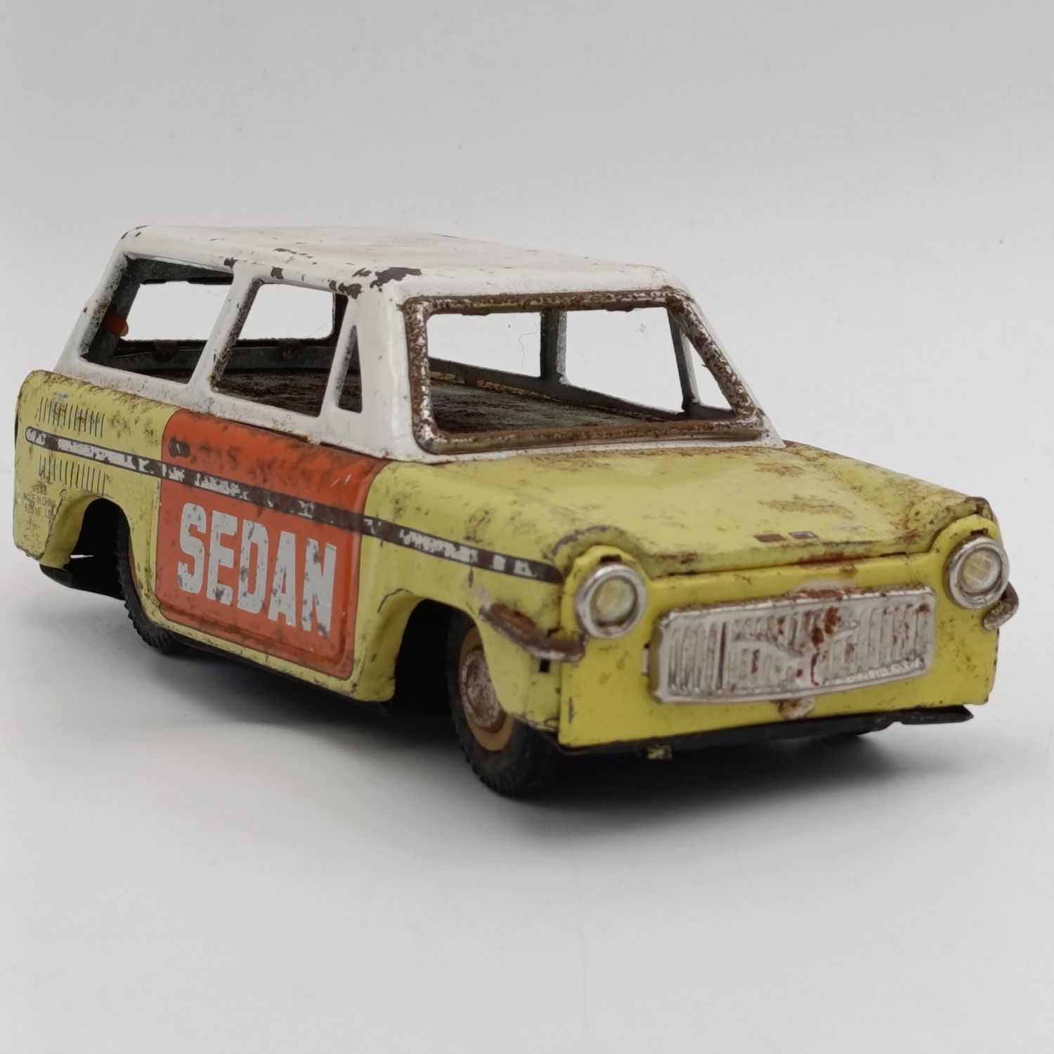Vintage Chinese tinplate Sedan friction toy car