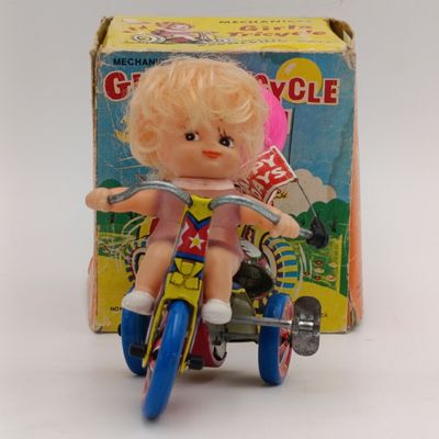 Vintage Tinplate Mechanical Girls tricycle toy in box - working