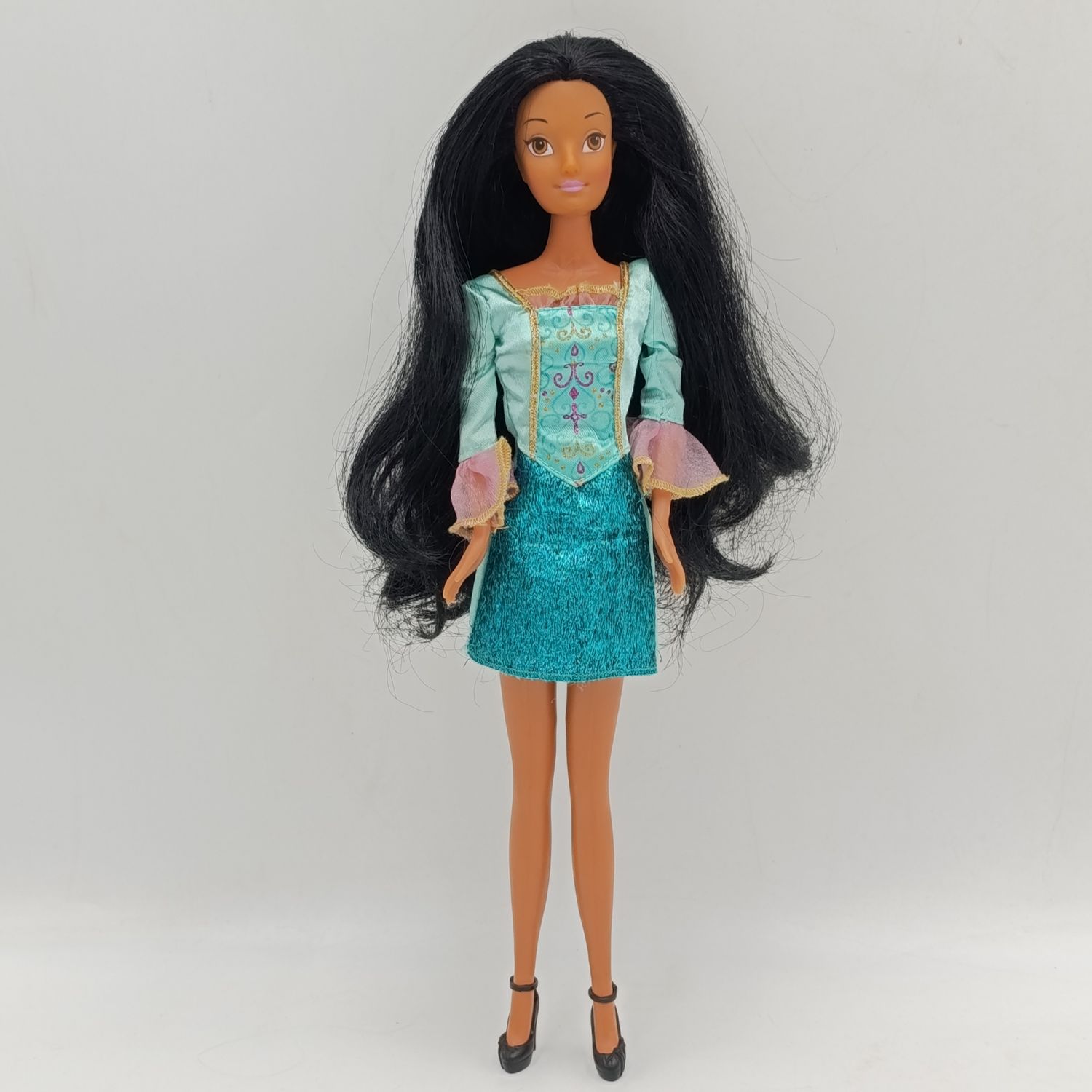 Doll with beautiful black hair and green dress