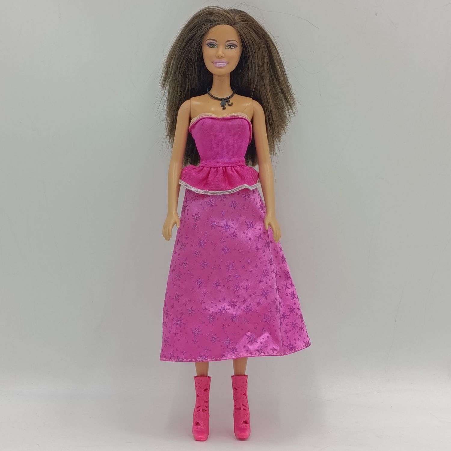 Barbie with pink dress, shoes and necklace