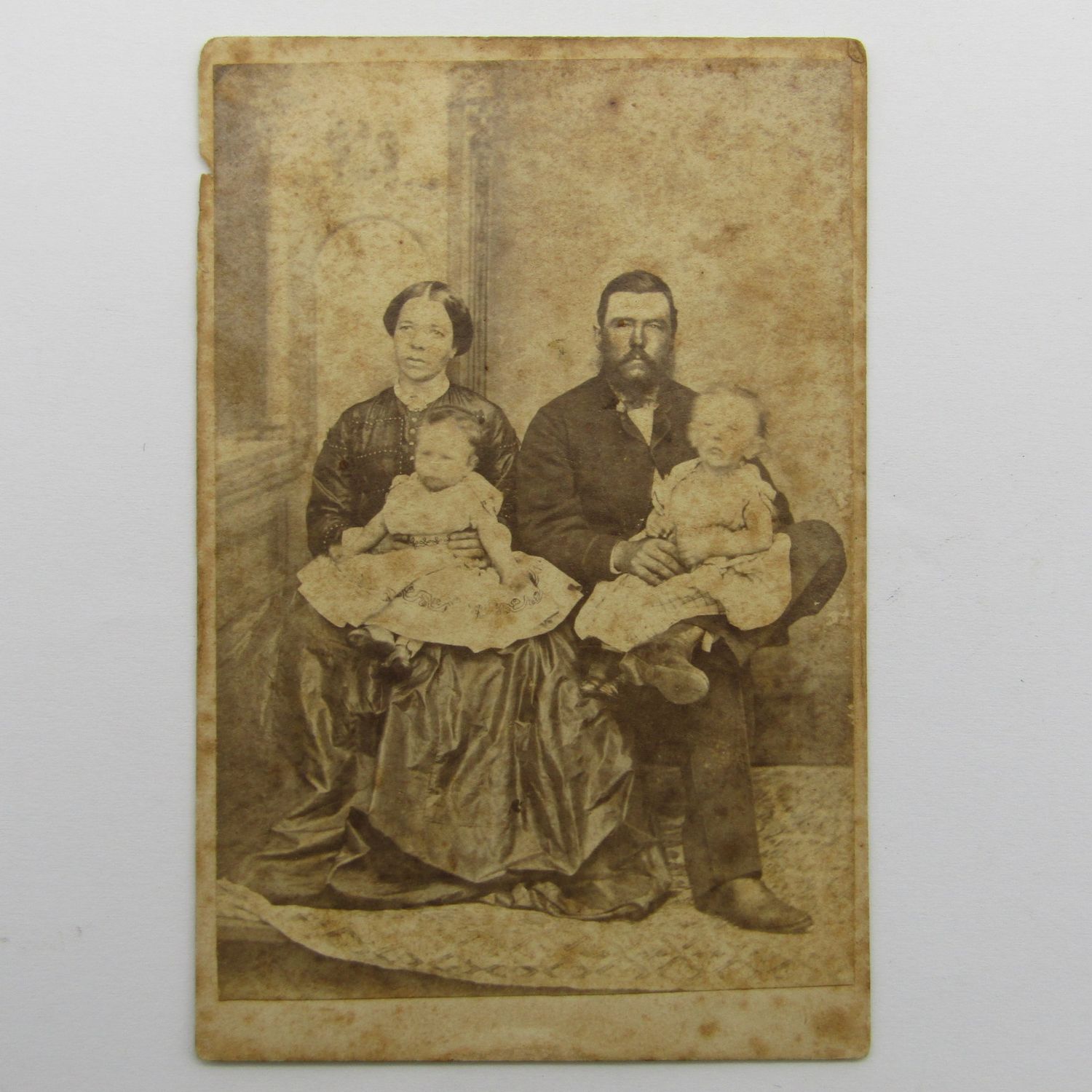 Antique photo of husband and wife with 2 children