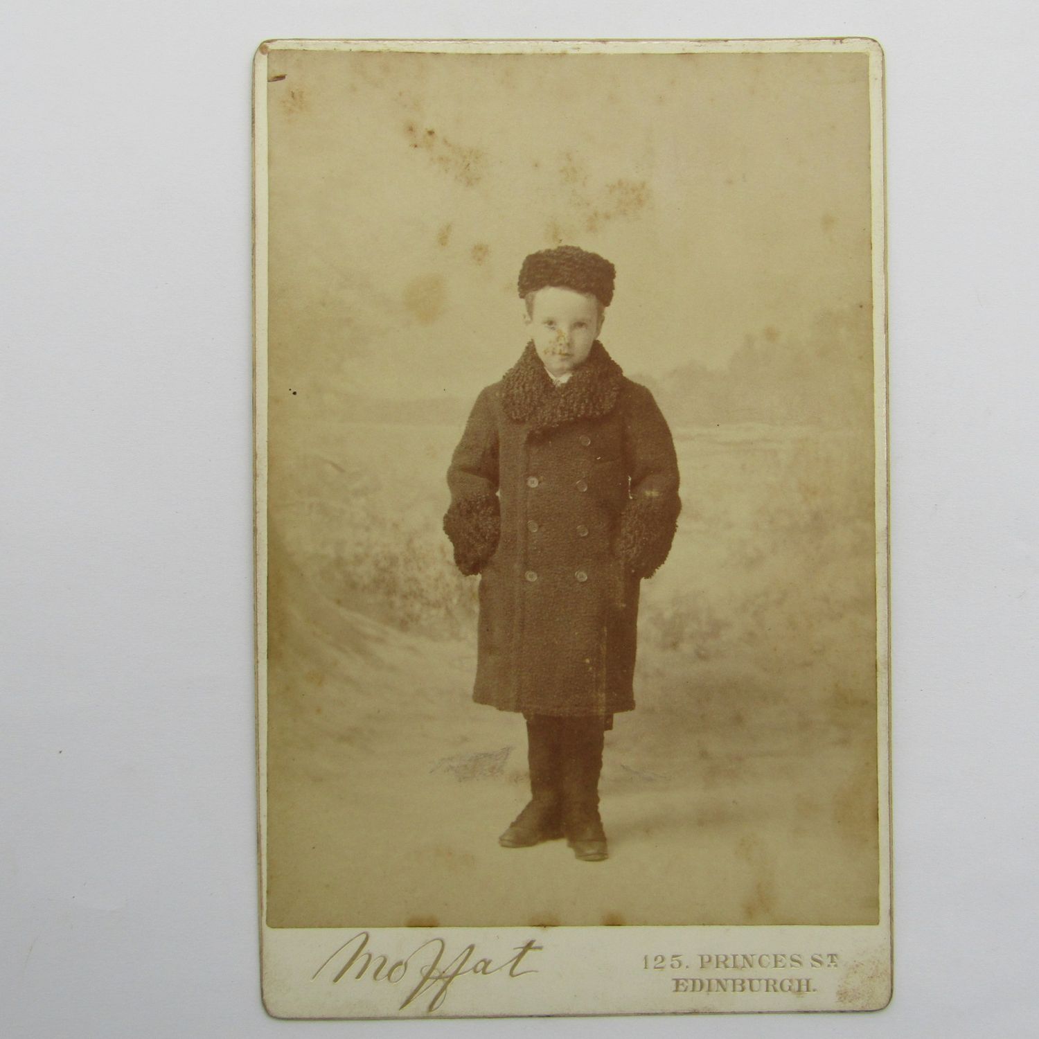 Antique photo of young boy in winter clothes taken by Moffat of Edinburgh