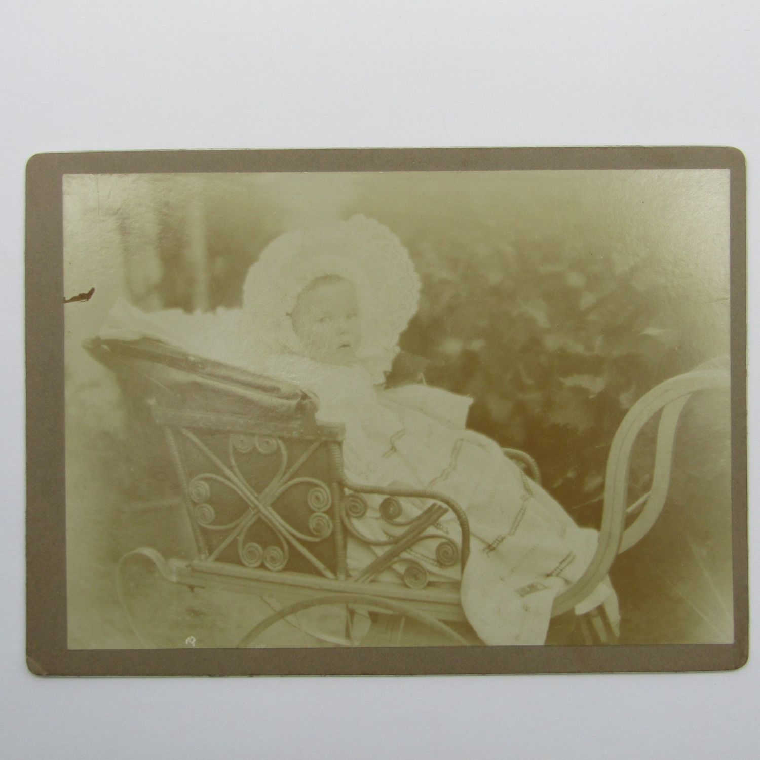 Antique photo of baby in pram