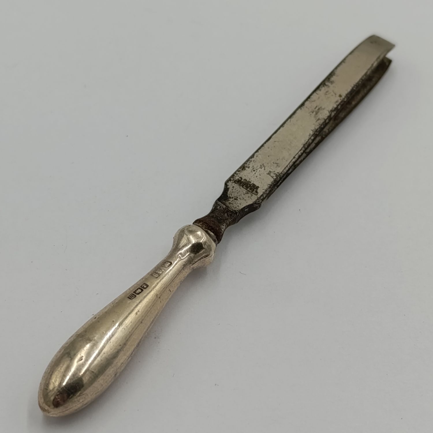 Antique tweezers with hallmarked sterling silver handle