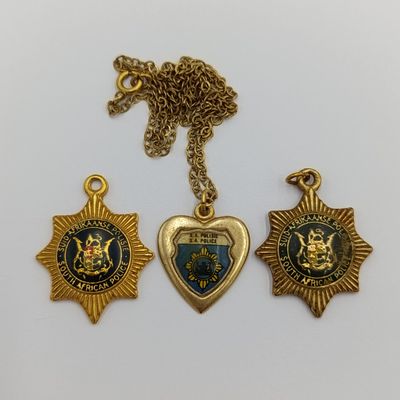 Lot of vintage SA Police pendants and charms
