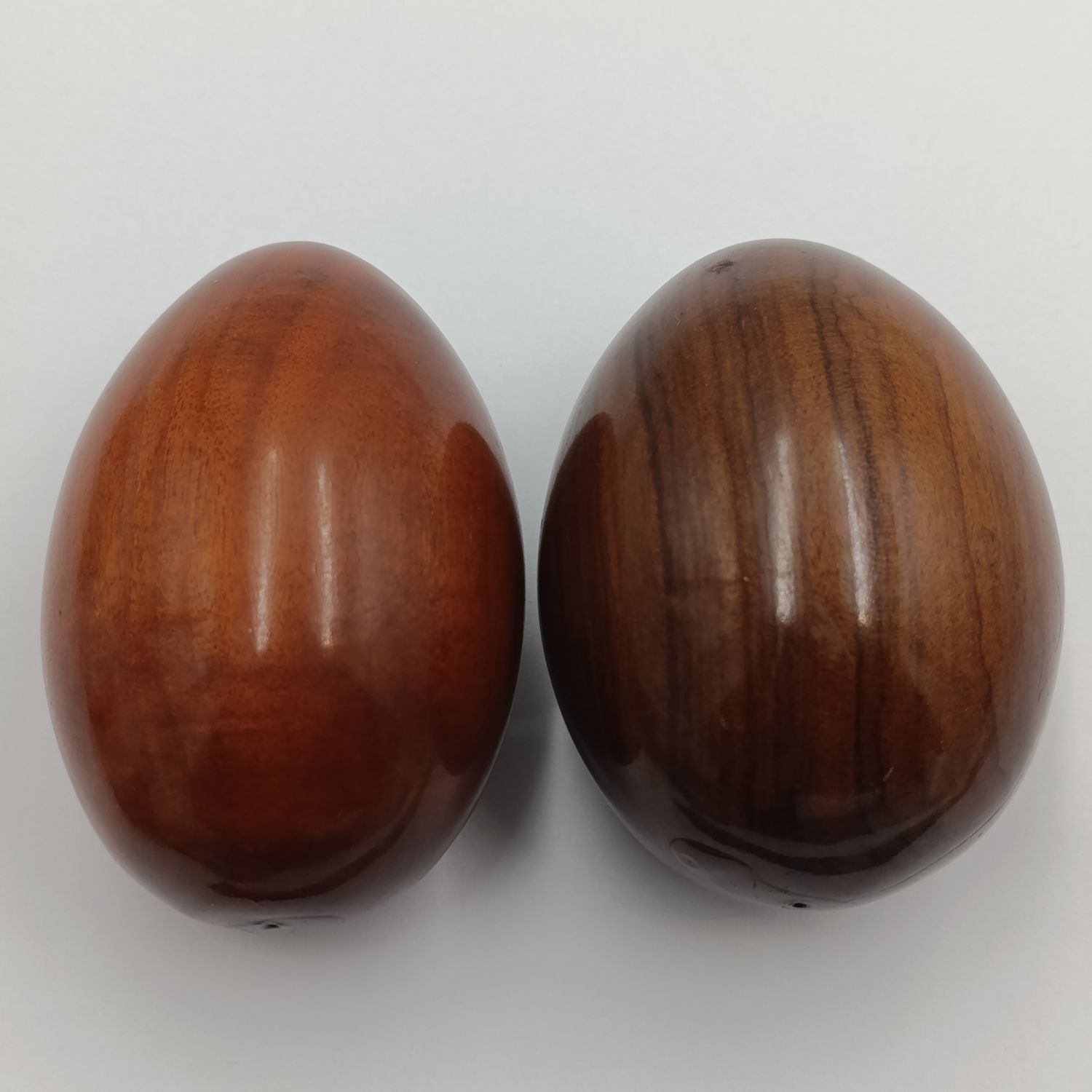 Pair of wooden carved eggs