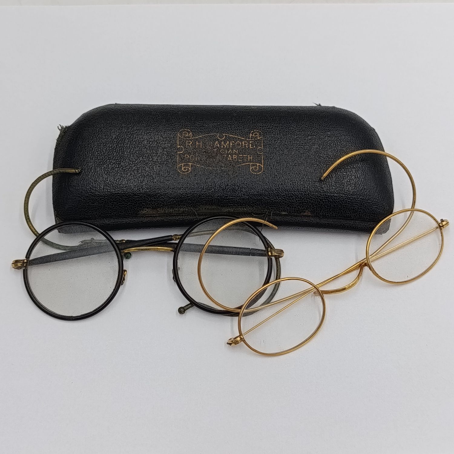 Pairs of Antique prescription glasses in case