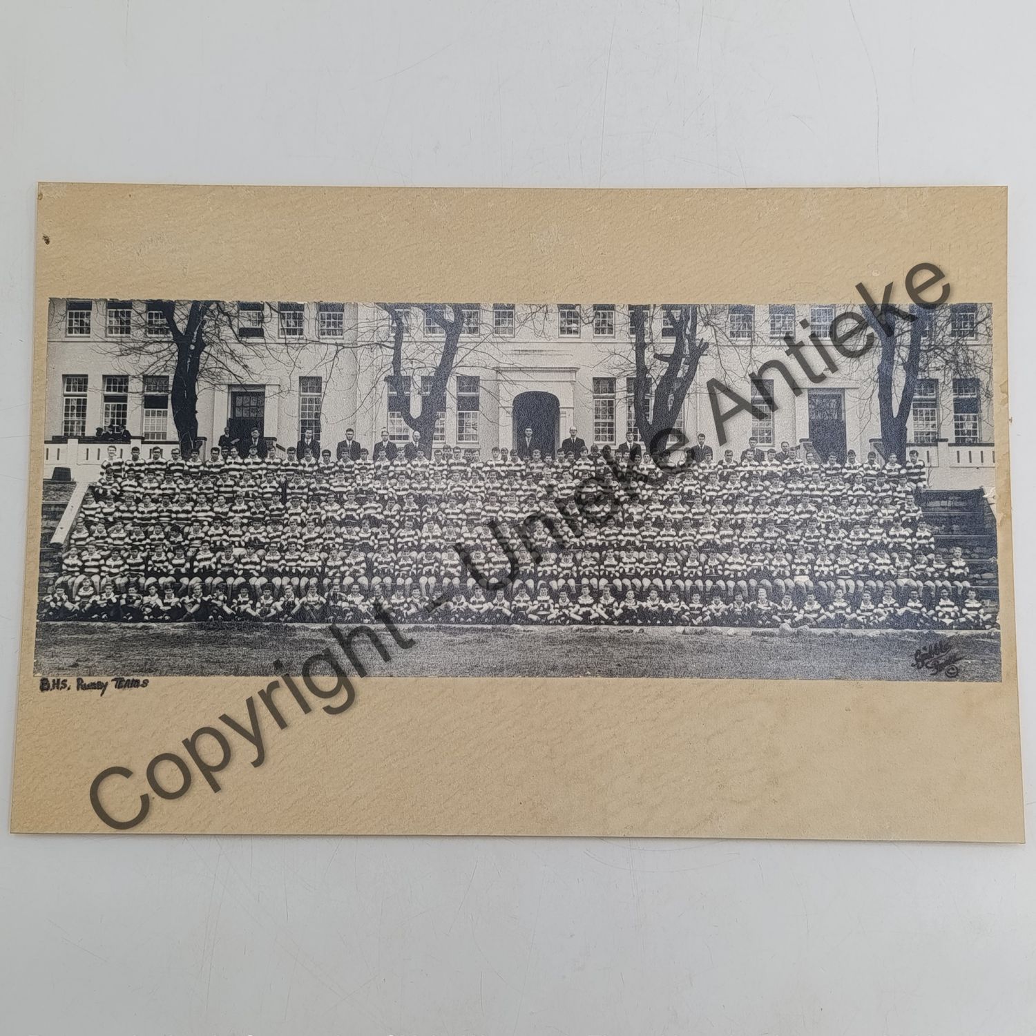Vintage photo of Boys High school in Paarl - all rugby players and some teachers in front of the building