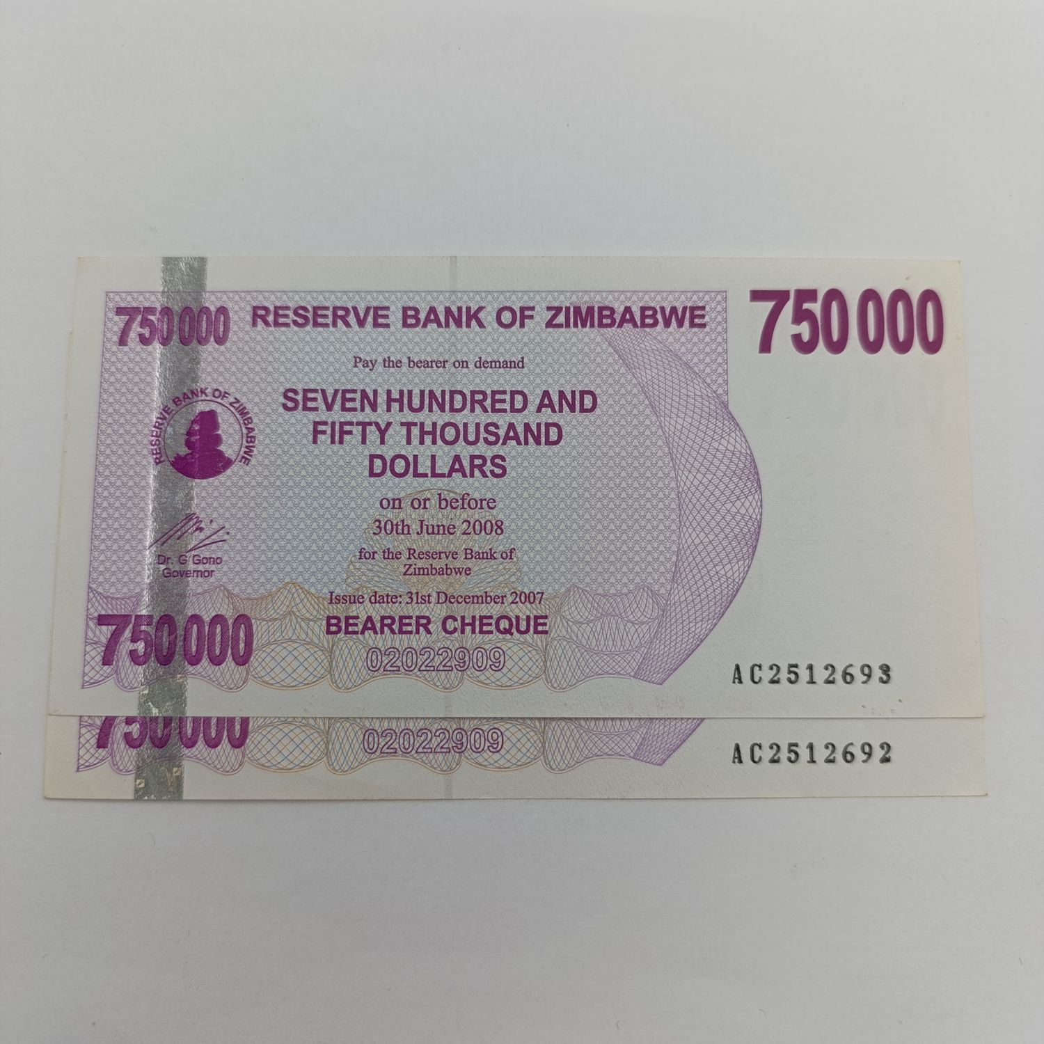 Zimbabwe 2007 issue bearer cheques 750 000 dollars - Double thick printing of serial numbers uncirculated and consecutive numbers