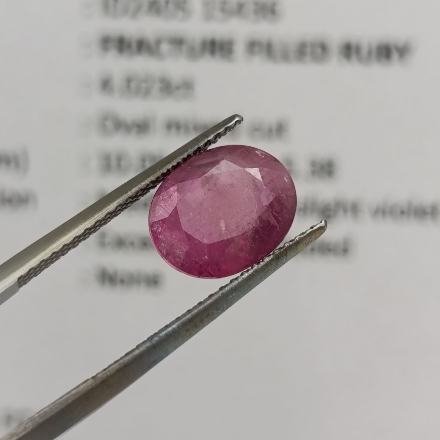 Fracture filled Ruby slight violet red Oval mixed cut 4.02 carat with Gemlab certificate