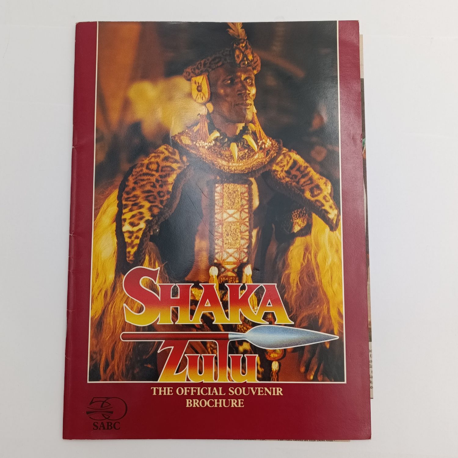 Original Souvenir Brochure for the film Shaka Zulu - with a few Newspaper cuttings about Henry Cele