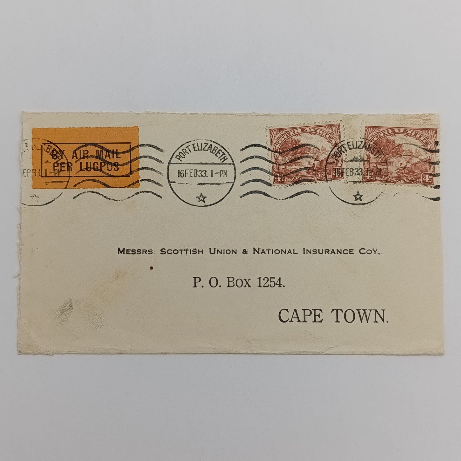 Air Mail cover from Port Elizabeth to Cape Town 16 February 1933 with Port Elizabeth roller cancellation and orange Air Mail label
