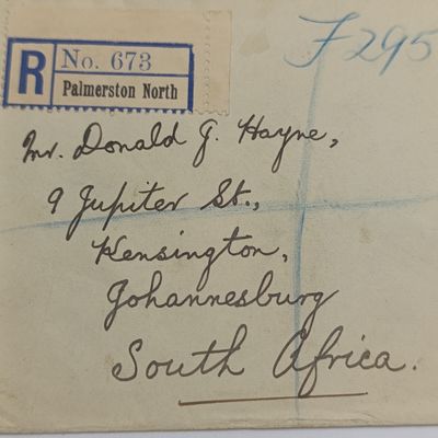 Registered Air Mail cover from Palmerston North New Zealand to Johannesburg South Africa with SG 570-571 stamps - unclear Palmerston cancellation - also New Zealand Centennial Exhibition 1940 label