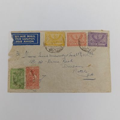 Airmail cover Mecque Saudi Arabia to Durban South Africa cancelled on 18-12-1938 with 5 Saudi Arabian stamps and blue airmail label backstamped 12 December 1938 Alexandria and 11 Dec 1938  Port-Taufiq
