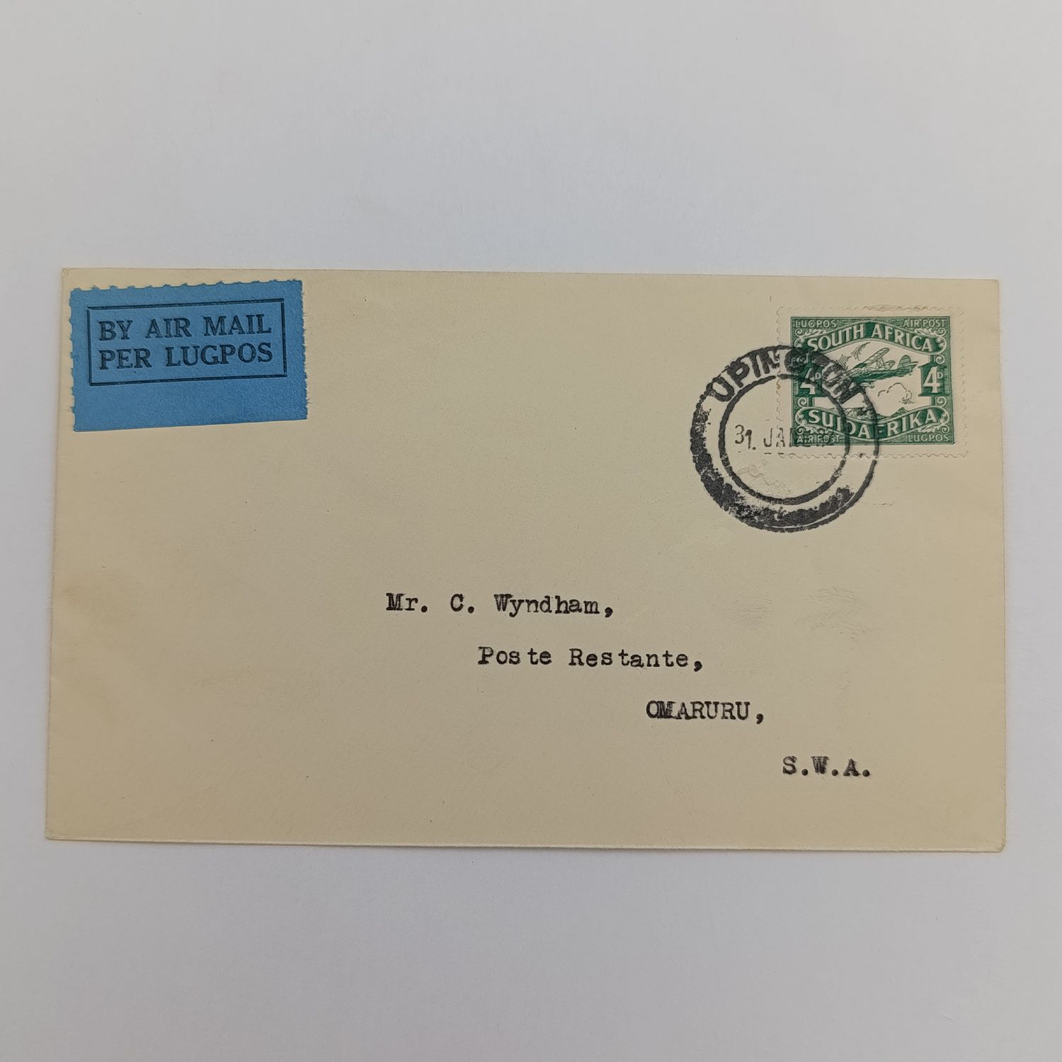 Airmail cover Upington South Africa to Tsumeb SWA with 4d stamp cancelled Upington 31 Jan 1932 and blue Airmail label backstamped Tsumeb 6 Feb 1932 and First Air Mail Windhoek Kimberely 2-2-32 cancel