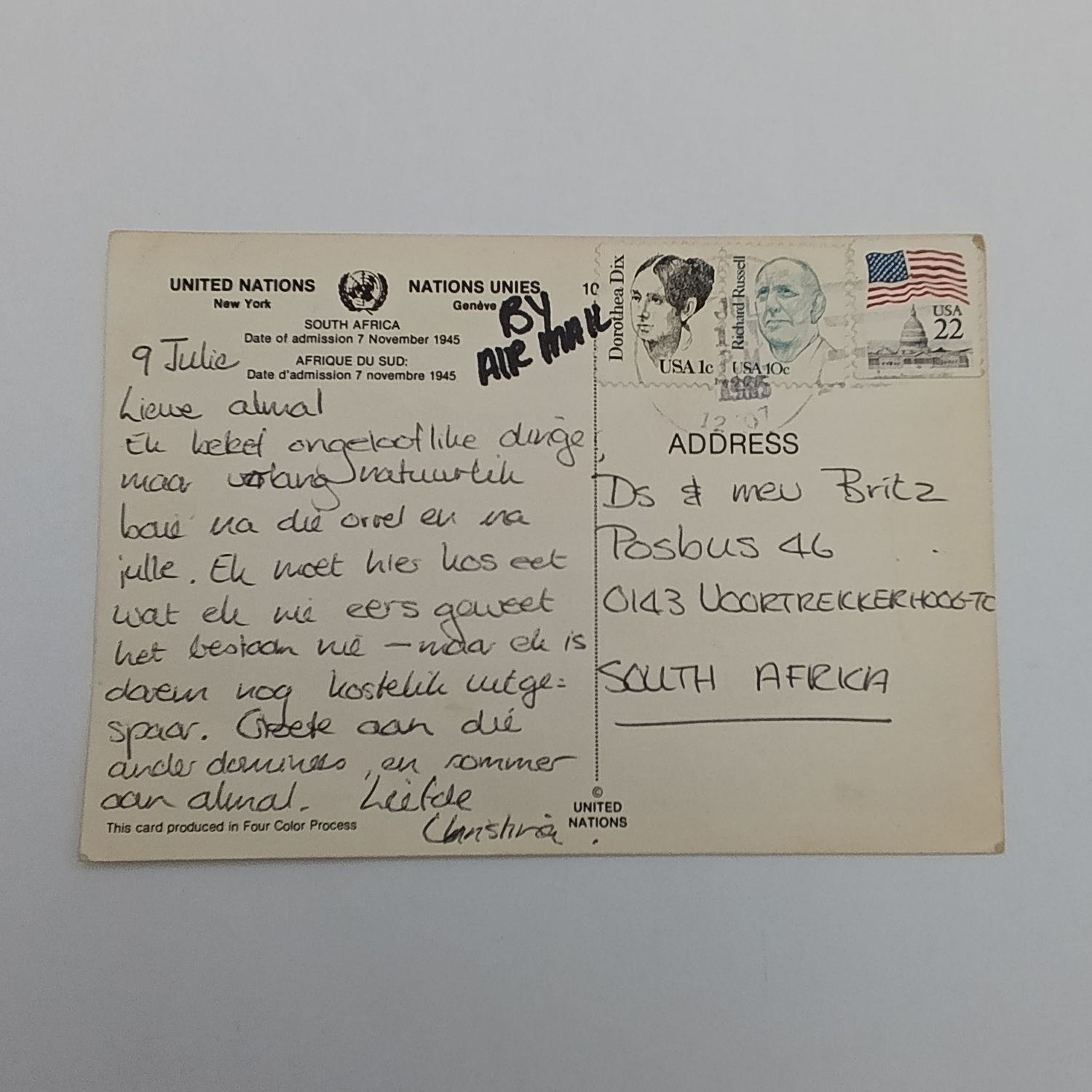 1985 United Nations postcard with old South African flag - USA to South Africa