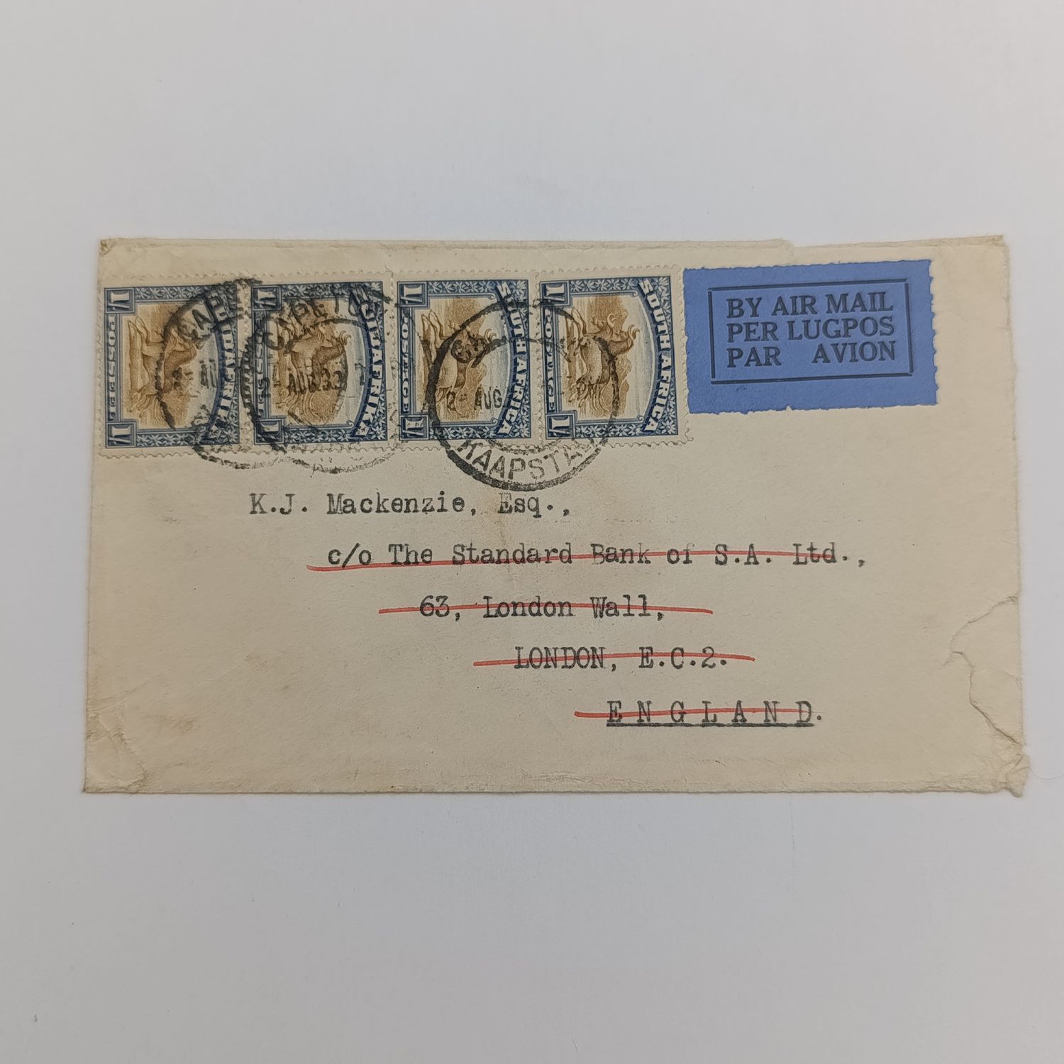 Airmail cover from Cape Town, South Africa to London, England 2 August 1932 with four SACC 36 one shilling stamps and Cape Town cancellations - Standard Bank of South Africa embossed stationary