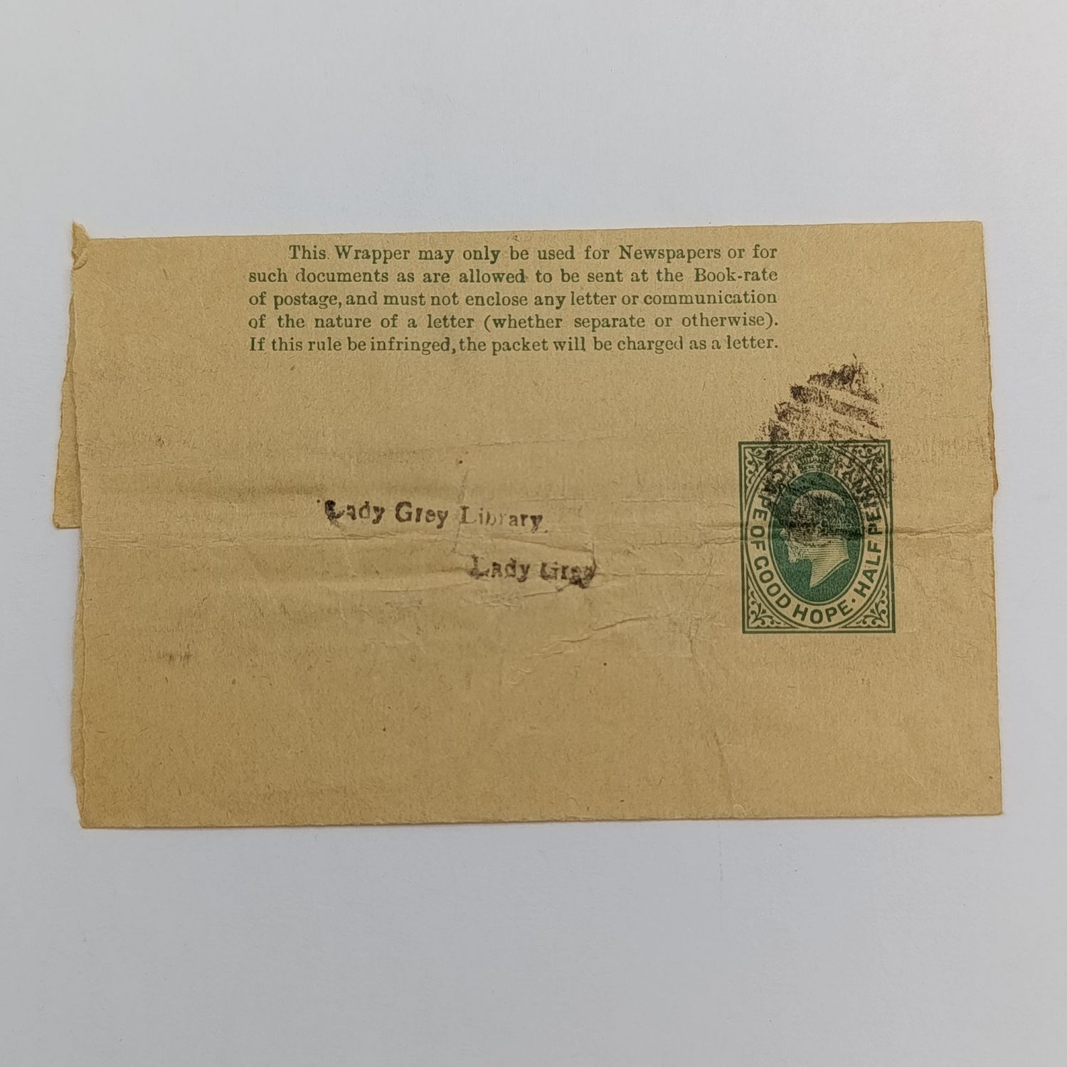 +- 1903 Newspaper wrapper with pre printed Edward 7 Cape of Good Hope Half penny - posted to Lady Grey Library - 1011 Barred numeral cancel