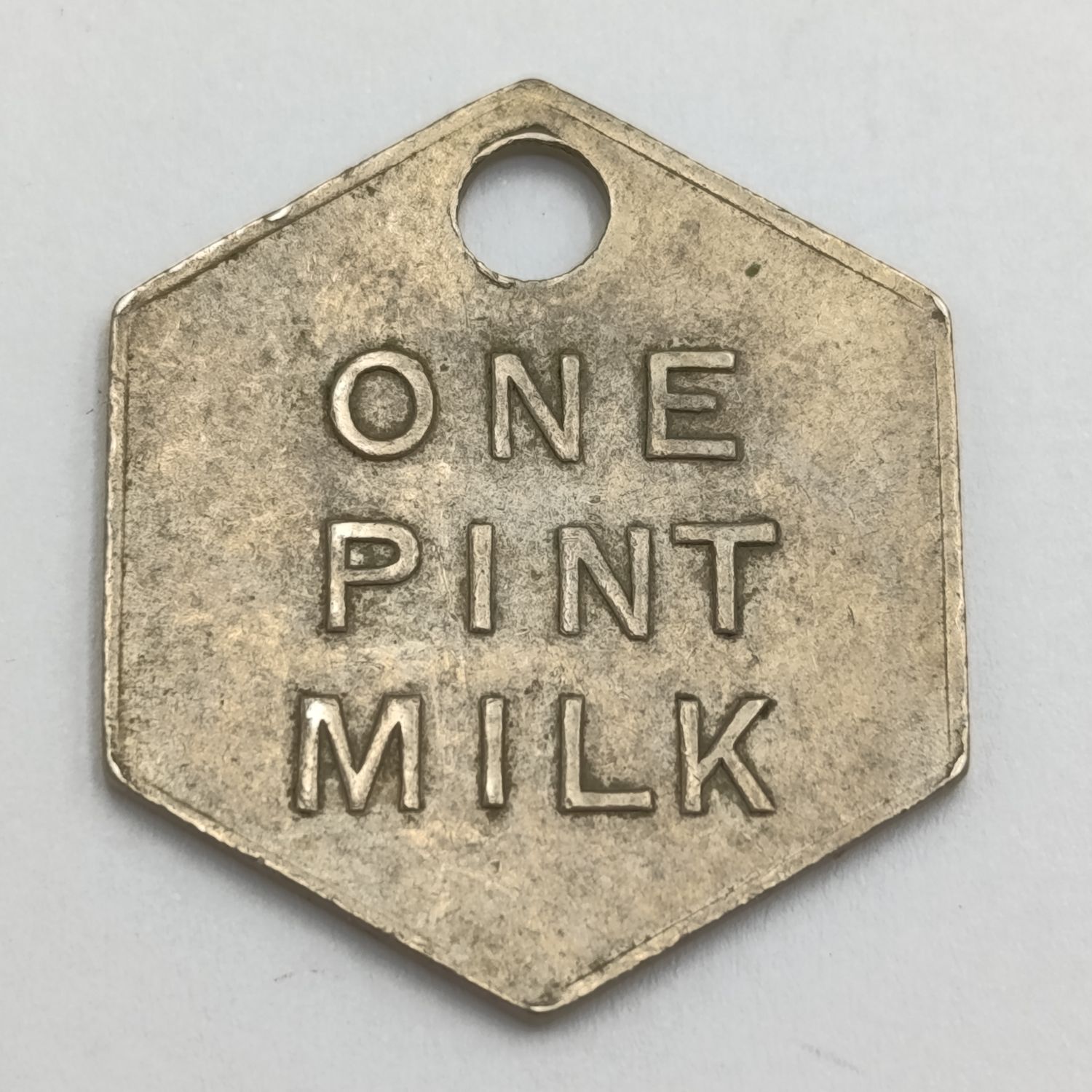 Model Dairy East London One pint hexagon milk token
