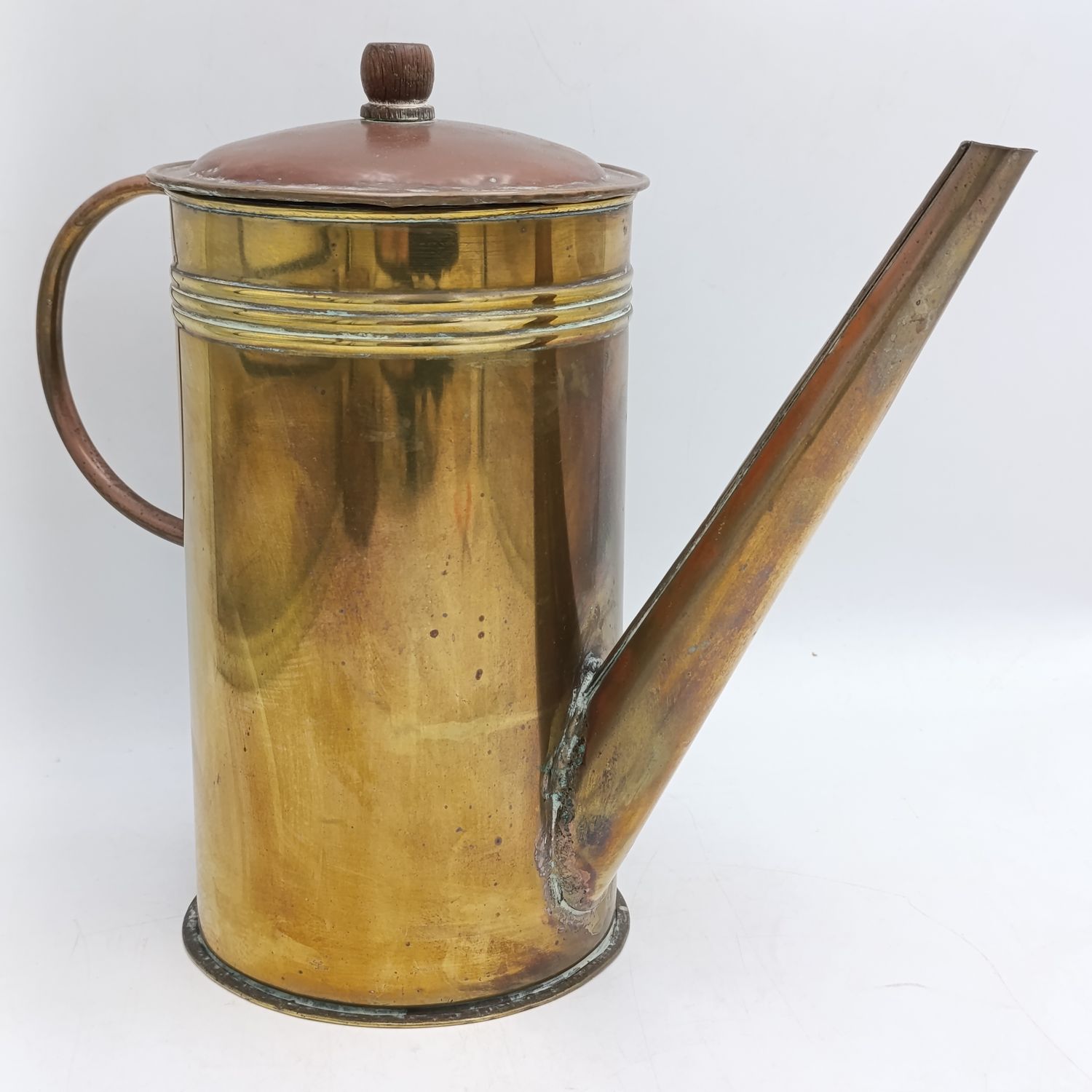 Antique brass watering can