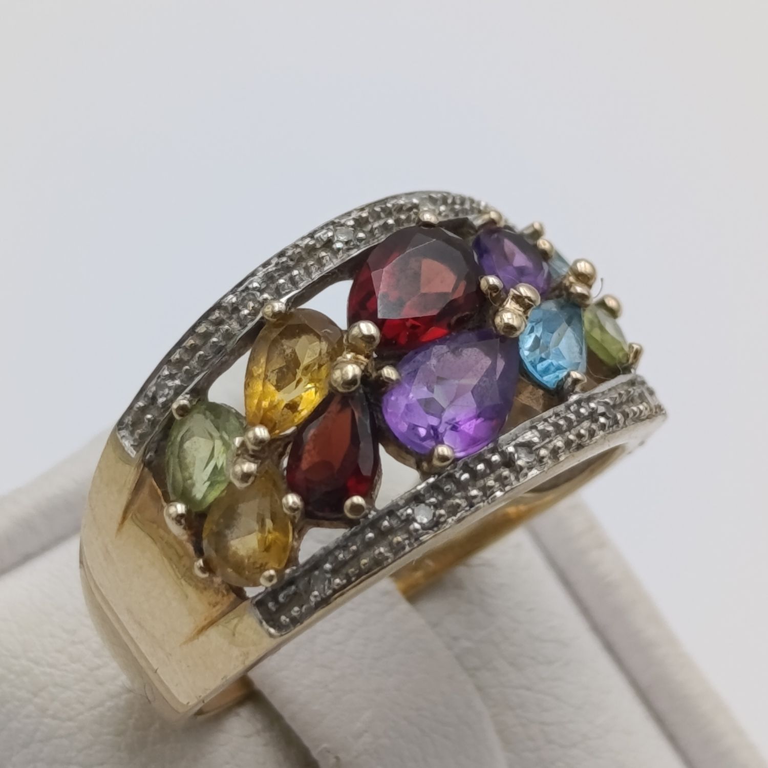 9kt Gold Ring with Spinel, Topaz, Tourmaline, Citrine and other stones. 10 stones total plus 10 small diamonds. Weight 3.7g, Size O