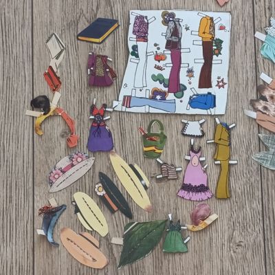 Large lot of vintage paper dolls with various dresses