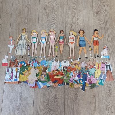 Large lot of vintage paper dolls with various dresses