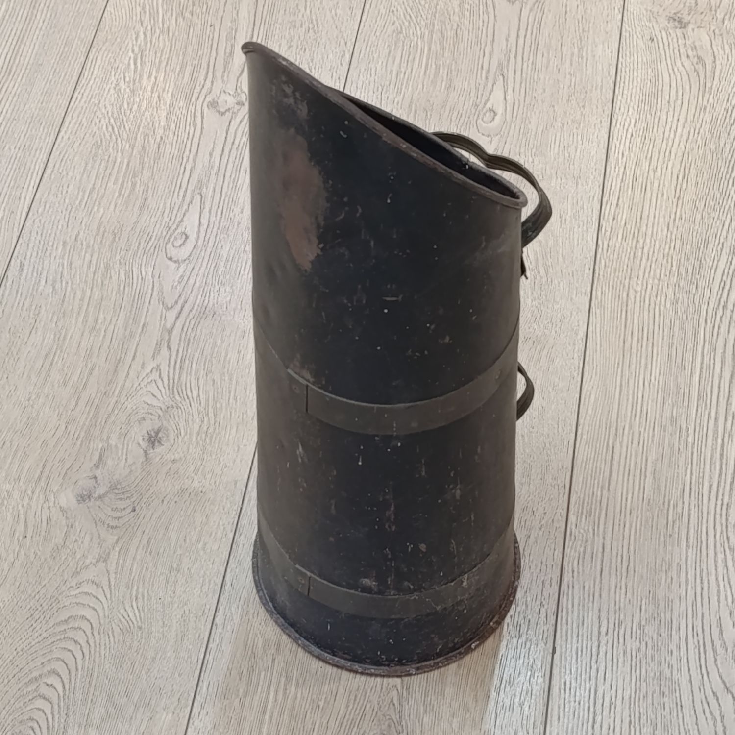 Antique metal coal scuttle with brass handles