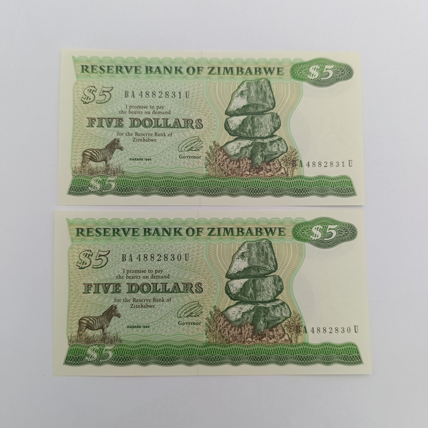 Zimbabwe 1994 pair of $5 banknotes uncirculated with consecutive numbers - short neck bird watermark
