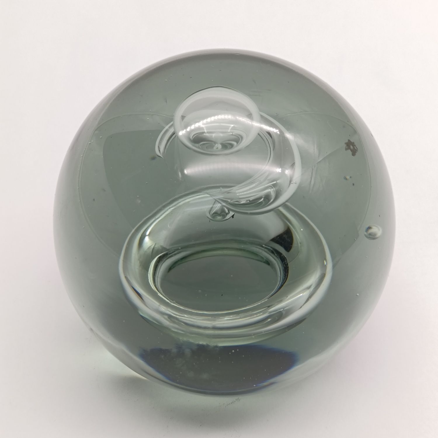 Vintage glass paperweight with water drop design inside