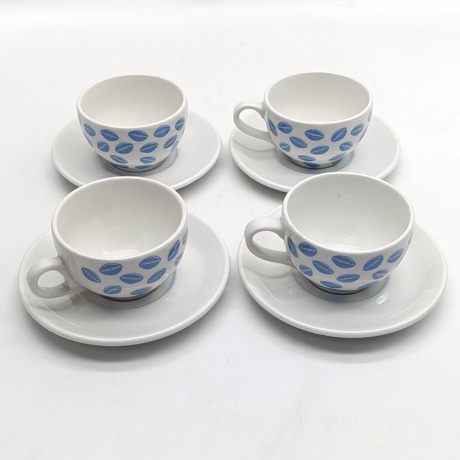 Set of 4 Viagra advertising porcelain cups and saucers