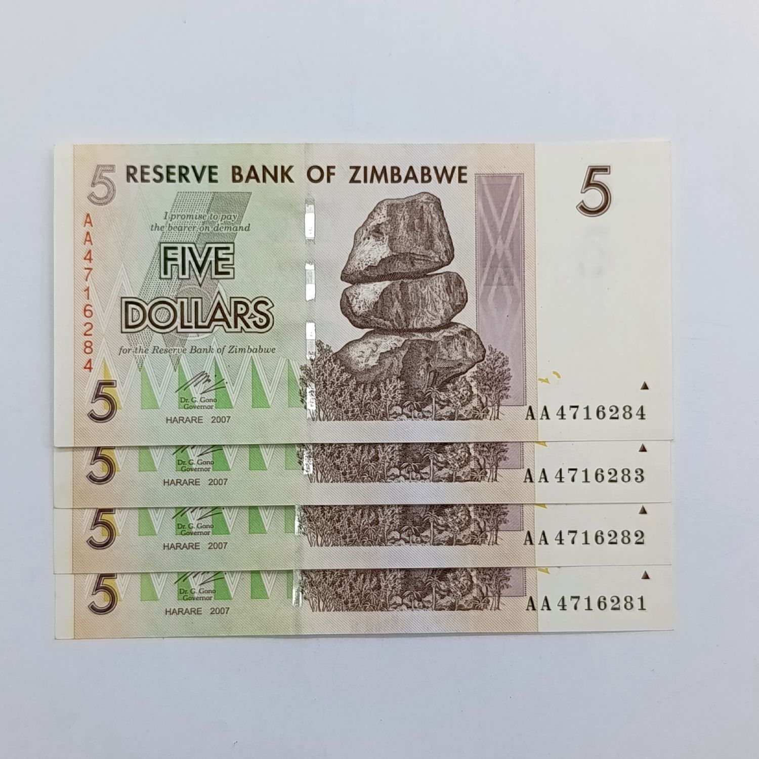 Zimbabwe lot of 4 x $5 Harare 2007 banknotes - all uncirculated AA numbers