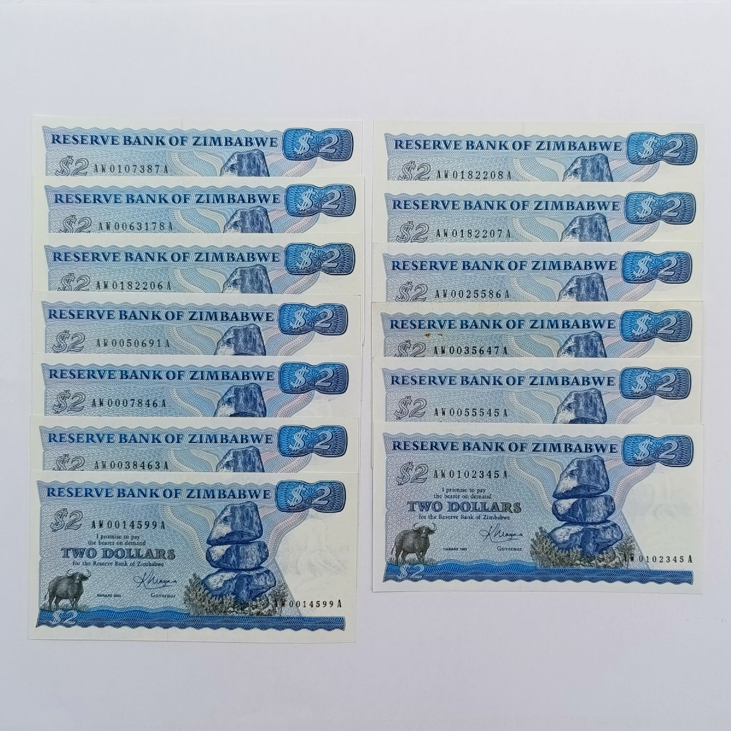 Zimbabwe 1983 Harare $2 Pick 1b lot of 12 replacement notes uncirculated - only 2 with consecutive numbers - with original wrapper