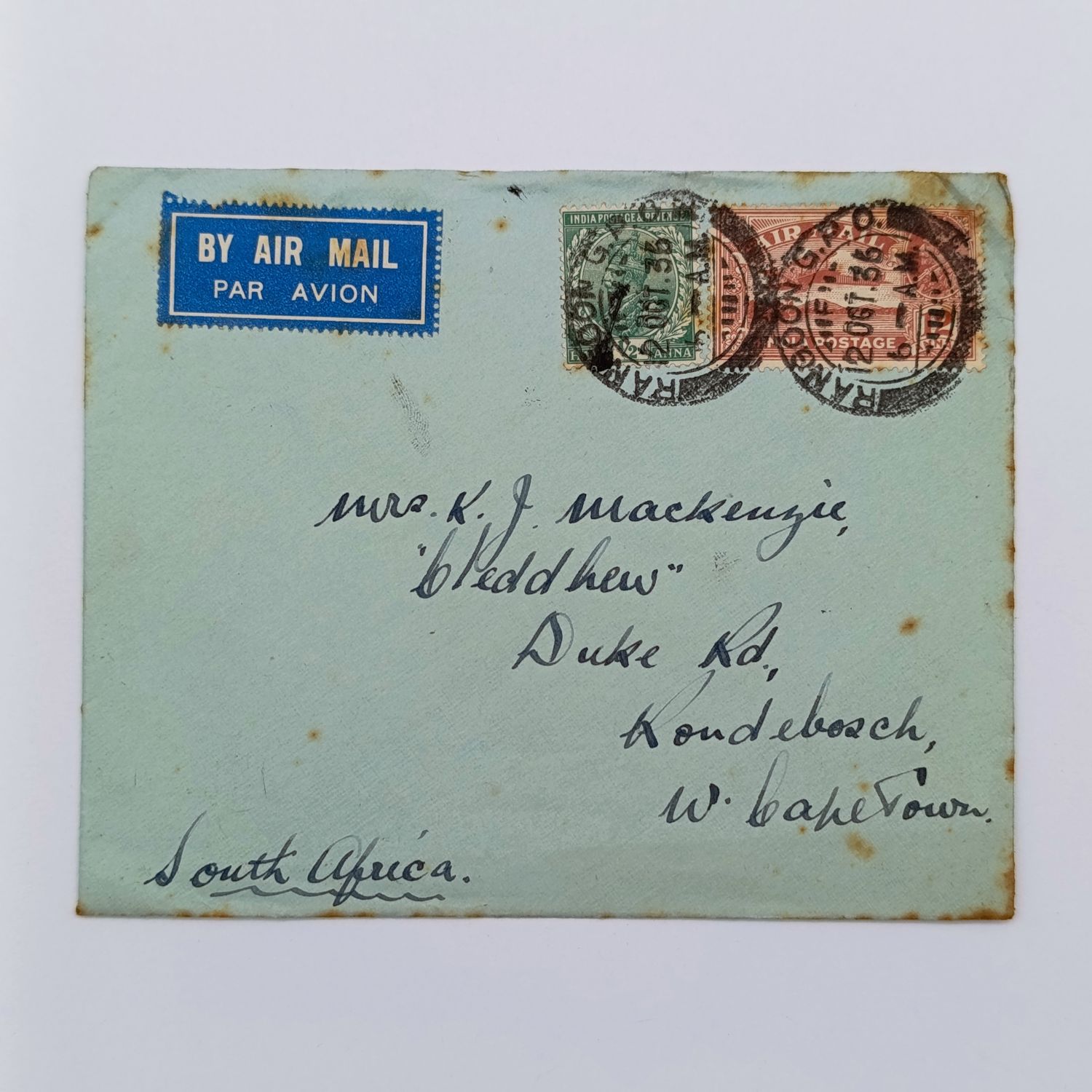 Airmail Cover Rangoon Burma to Rondebosch South Africa with 2 India stamps cancelled 2 Oct 1936 and blue airmail label