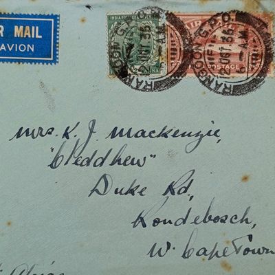Airmail Cover Rangoon Burma to Rondebosch South Africa with 2 India stamps cancelled 2 Oct 1936 and blue airmail label