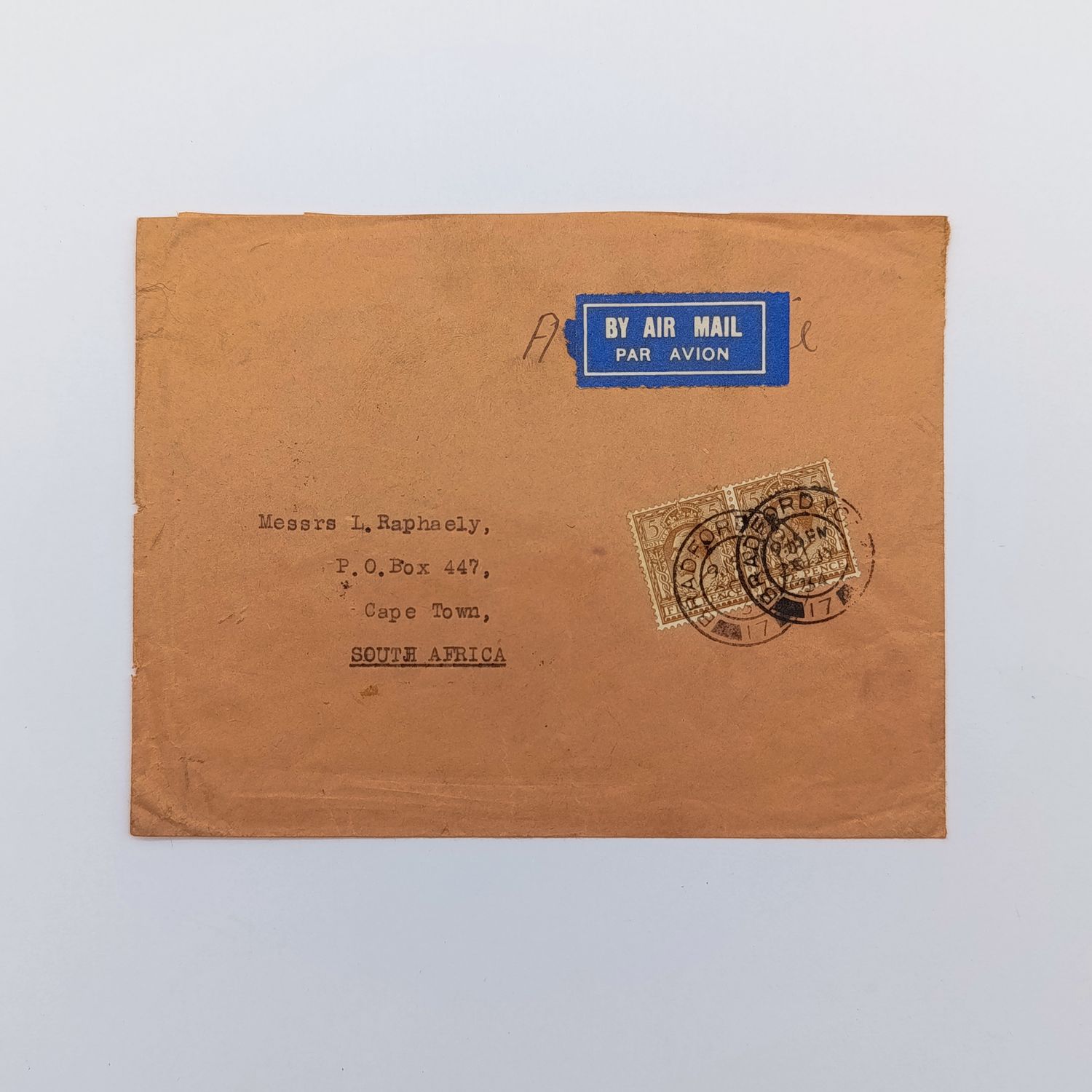 Bradford Great Britain to Cape Town South Africa with 2x British 5 pence stamps cancelled 20 July 1934 and blue airmail label backstamped Cape Town 3 Aug 1934