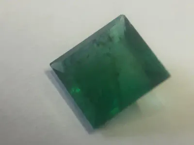Natural Emerald of 0.737 of square step cut slight bluish green with Gemlab certificate