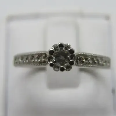 9kt White Gold diamond ring with 0.10ct diamond and smaller 0.15ct in total - weighs 2.2g - size L/6
