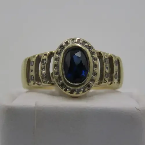 9kt Gold ring with 12 Diamonds and center stone dark blue ( Ring Size - K 1/2)