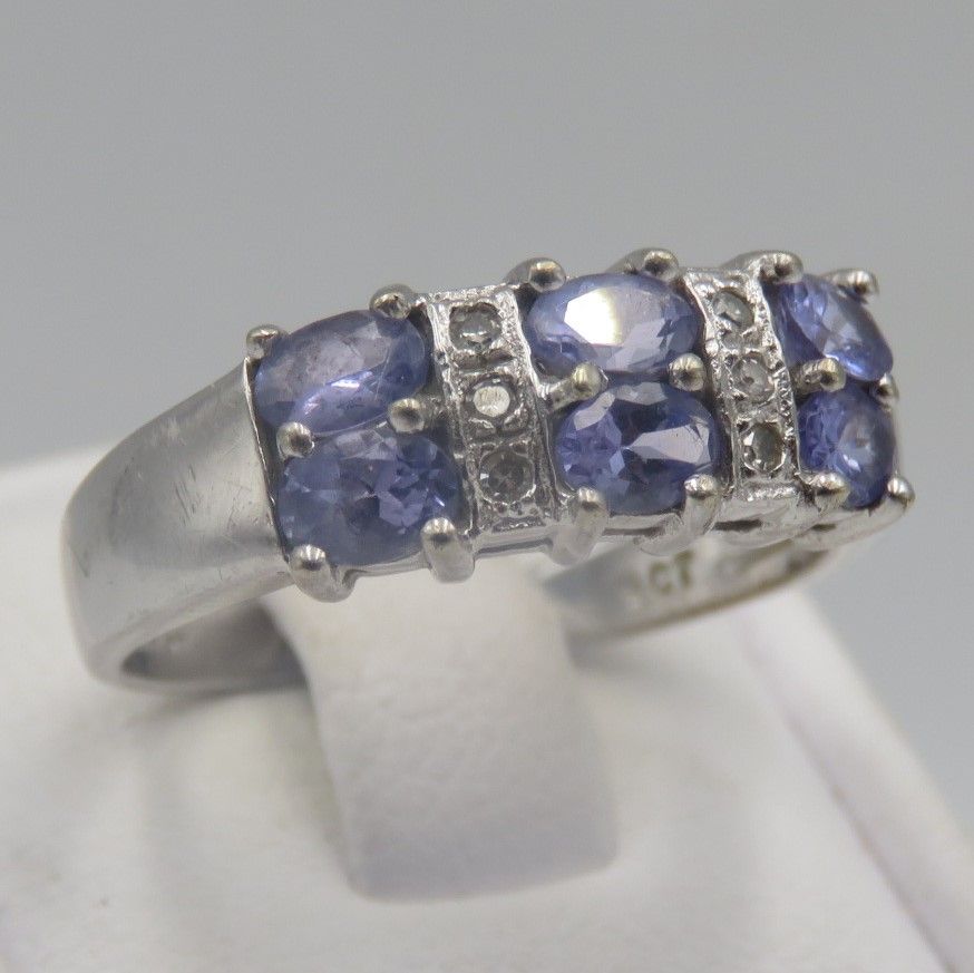 9kt white gold ring with 6 small diamonds and 6 Iolites. Weight 3.5g, Size O