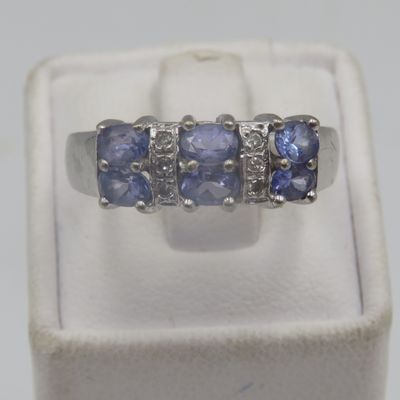 9kt white gold ring with 6 small diamonds and 6 Iolites. Weight 3.5g, Size O