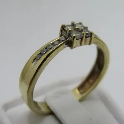 9kt gold ring with 14 small diamonds of about 0.25ct in total - weighs 2.9g - size Q/8
