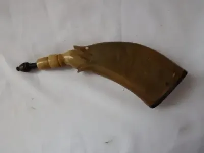 Antique gunpowder horn in the shape of a fish